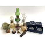 A mixed lot to include Dartington Crystal 'Capredoni' floral paperweights, boxed, small oil lamps,