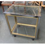 A chrome brass and glass two tier side table, in the manner of Zevi, 70x45x69cm