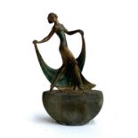 An Art Deco spelter table lighter, with striker, in the form of a dancing lady, 17.5cmH