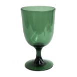 A large late 19th/early 20th century hand blown green glass goblet, on stem and spreading foot, 33cm