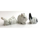 A Royal Copenhagen figurine of a pair of rabbits no.518; a single rabbit no.4705; and a further