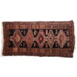 A west Persian runner rug, five serrated lozenges, 226x118cm