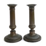 A pair of Old Sheffield Plate candlesticks, removable gadrooned nozzles, loaded bases