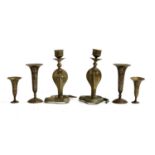 Two late 19th/early 20th century brass Cairo ware cobra snake candlestick holders, the tallest