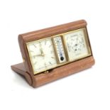 An Angelus Sentry leather cased travelling desk clock, thermometer and barometer, embossed F.M