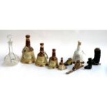 Breweriana Interest: Four graduating Bell's ceramic bell form whiskey bottles, together with a