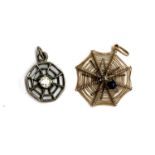 An early 20th century 9ct gold spiderweb pendant, 0.8g, 2cmD; together with a smaller white metal