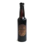 Breweriana interest: A vintage Guinness Extra Stout bottle, sealed with contents, the label