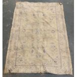 A faded yellow ground rug, approx 149x108cm