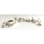 Five white porcelain horse figurines; together with a dog; angel and bird figure group salt