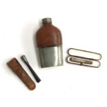 Two early 20th century silver and bakelite cheroot holders; together with a leather hip flask with