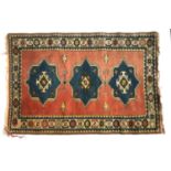 A wool rug, red ground, three blue stars, 190x132cm