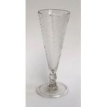 A conical ale glass, spirally blown, on a folded foot, 15cmH