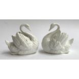 A pair of continental porcelain swans, marked H D & Co to base, each 14.5cmH