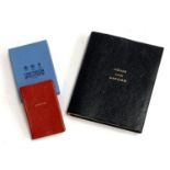 A Smythson of Bond Street small red leather bound book marked 'Singles', boxed; together with a