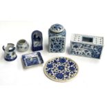 A Delft tea caddy, together with a Mottahedeh flower arranging brick, 15.5cmW, Delft candle