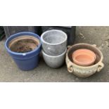 A quantity of plant pots, some terracotta, the largest 33cmD