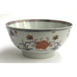 A 19th century Chinese export bowl, with staple pairs, floral decoration in orange and blue, 23cmD