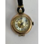 An early 20th century 9ct gold cased ladies watch, strap af