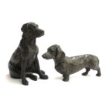 A cold cast bronze resin figure of a dachshund, 21cmL, and a retriever, 19cmH