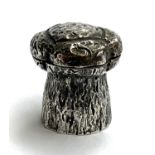 A small 800 grade silver trinket pot in the form of a champagne cork, marked 'champagne' to base,