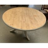 A 20th century pine and grey painted circular table by The Pine Mine, Wandsworth Bridge Road, on