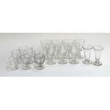 A lot of seven small cut glass wine glasses; eight 19th century and later custard cups; and two hand