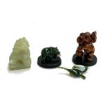 A carved onyx foo dog, approx. 6cmH; together with a carved jadeite figurine of a bear holding a