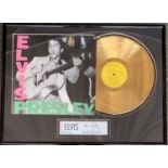 A framed and glazed special edition gold plated Elvis Presley record with 9 songs to include