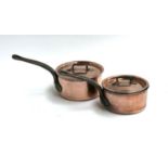 Two Bourgeat stainless steel and copper clad saucepans, numbered 18 and 16, with lids