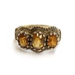 A 9ct gold citrine trilogy ring, size N, 3.1g