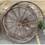 Three wagon wheels, one wooden with metal rim and spokes, the largest 128cmD