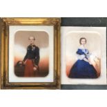 A pair of Victorian three quarter length portraits of a naval officer and a lady in a blue gown,