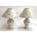 A pair of Laura Ashley floral table lamps with matching paper shades, 39cmH to top of shade