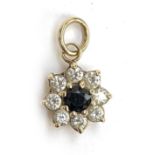 A 9ct gold floral cluster pendant set with a sapphire and white stones, 1cmD, 1.3g