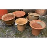 Six terracotta plant pots, the largest 41cmD