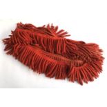 A 6m long length of red wool fringe