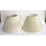 A pair of large pleated lamp shades, 50cmD at base; together with a trio of pleated lampshades of