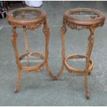 Interior design interest: A pair of 20th century carved beechwood torcheres, with circular glass top