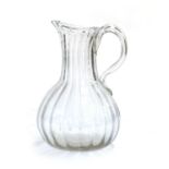 A 19th century hand blown glass jug, 17.5cmH