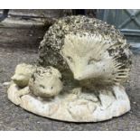 A composite stone figure of a hedgehog and hoglets, approx. 25cmW