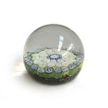 A glass millefiori paperweight, 6.5cm diameter