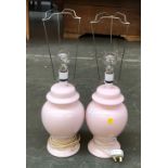 A pair of pink ceramic table lamps in the form of lidded vases, 28cmH to base of fitting, with