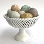 A lot of 14 mineral eggs in a porcelain basket