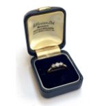 An early 20th century 18ct gold and diamond three stone ring, size O, approx. 2g