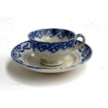 A small early 19th century blue and white spongeware teacup and saucer, 11.5cmD