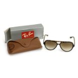 A pair of Ray-Ban tortoiseshell sunglasses, boxed with case