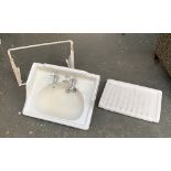 A white ceramic basin, with cast iron white enamel bracket, by Pontifex & Sons Ltd, 60cmW;