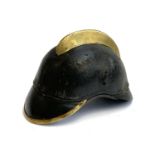 A 19th century leather and brass firemans helmet