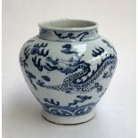 A Chinese blue and white vase, decorated with a dragon amongst clouds, 18cmH